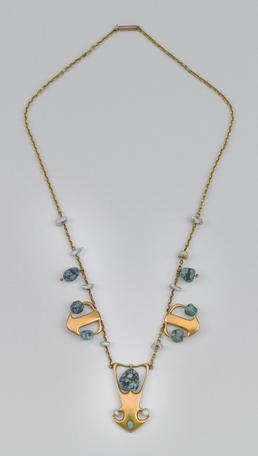 Liberty gold and turquoise necklace designed by Archibald…