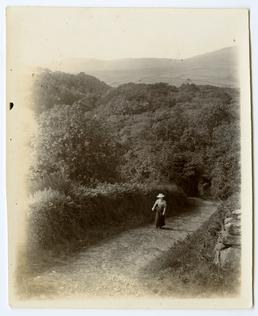 Lady walking up Ballaskeig old road, Maughold in…