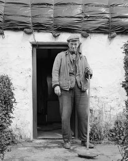 Eddie Hudgeon outside his cottage, Surby