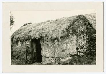 Mud cottage with thatched roof, Bride