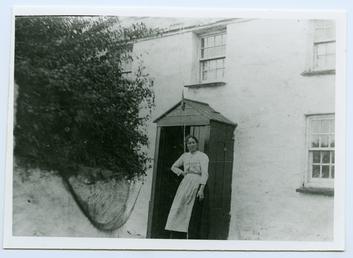 Cregneash Woman outside a cottage