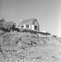 Thatched cottage and coastal erosion, Bride