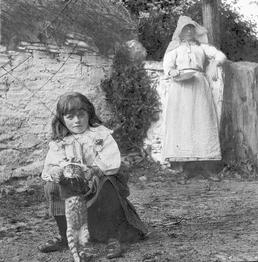 Woman and Girl by a Manx Thatched Cottage,…