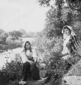 Two young girls on the banks of the…