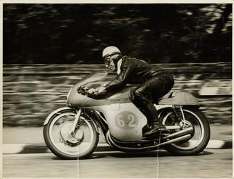 John Surtees riding as number 62, 1958 Junior…