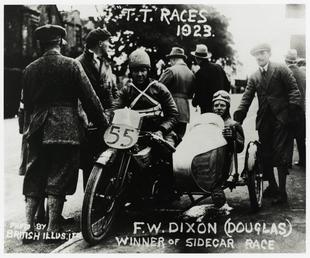 F.W. Dixon aboard Douglas sidecar outfit number 55,…