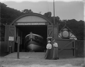 Two ladies standing outside Douglas Lifeboat Station with…