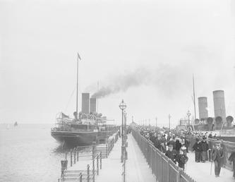 Passengers on Victoria Pier, Douglas with two paddle…