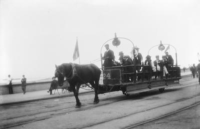 Open-top horse tram No.24 full of passengers on…