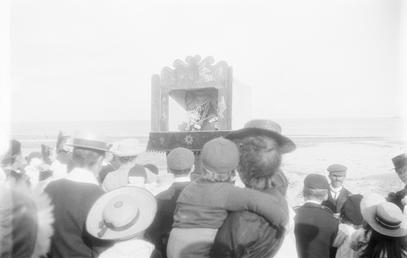 Crowd watching a Punch and Judy show, Douglas…
