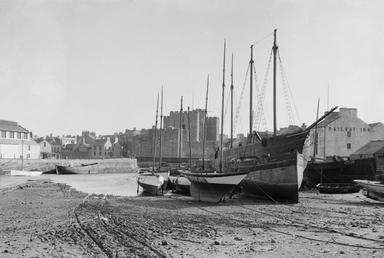 Castletown harbour with vessels, Castle Rushen and the…