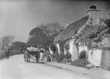 Thatched cottage and outbuilding with horse and cart…