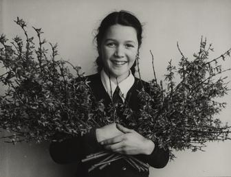 Linda Cain, standing holding foliage