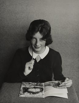 Moira Davies, sitting with book in Ramsey Grammar…