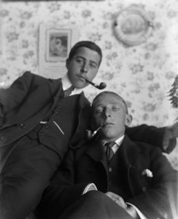 G. Halliday and E. Simpkins, seated with pipes…