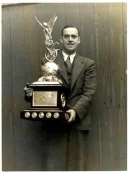 Harold 'Dusty' Miller with a trophy won by…