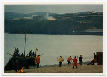 Bonfire on the headland while a viking ship…