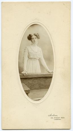 Photograph of young woman in a Moorcroft dress