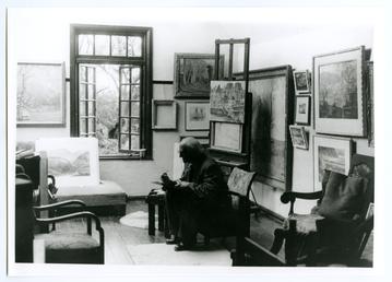 William Hoggatt painting in his cottage at Port…