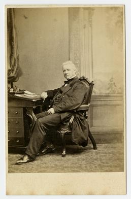 John Stanway Jackson - seated at desk