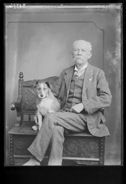 General Jones sitting with pet dog