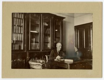 Philip Moore Callow Kermode seated at desk
