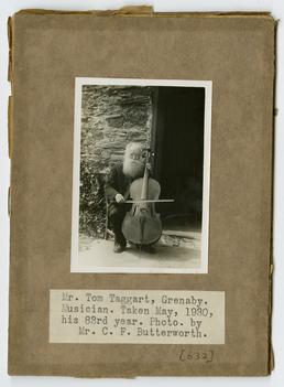 Tom Taggart, sitting outside with his cello