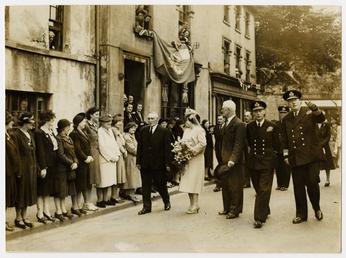 George VI and Elizabeth with officials and people…