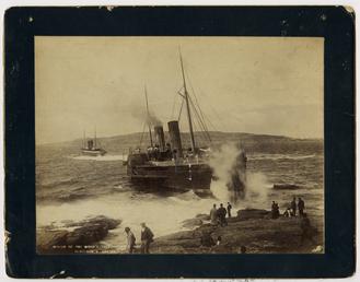 'Mona's Isle III' aground at Scarlett Point, being…