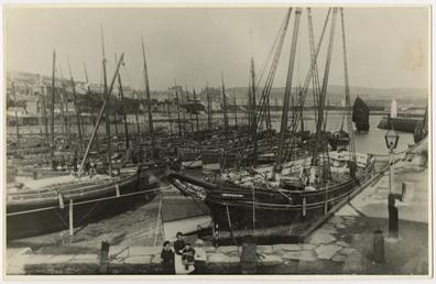 Port St Mary inner harbour, with a schooner,…