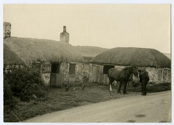 Horse and workman outside Smeale smithy