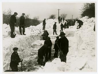 Group of men clearing snow - Kirk Michael