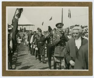 Lieutenant Governor Sir Montague Butler saluting the flag…