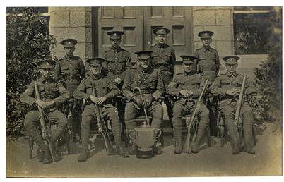 Military group, Isle of Man with trophy and…
