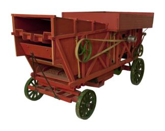 Scale model of a threshing machine as used…